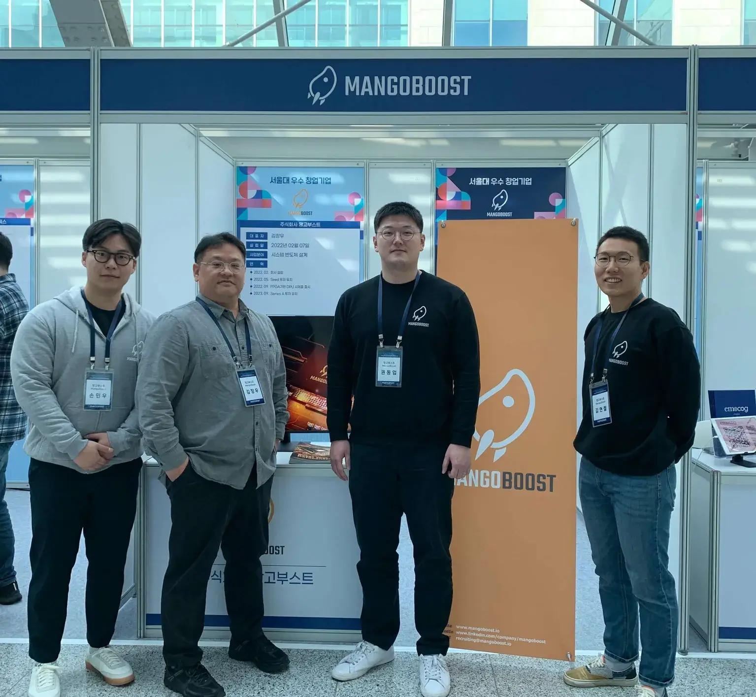 mangoboost team at event booth